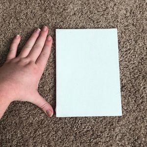 Nine (9) small white canvases